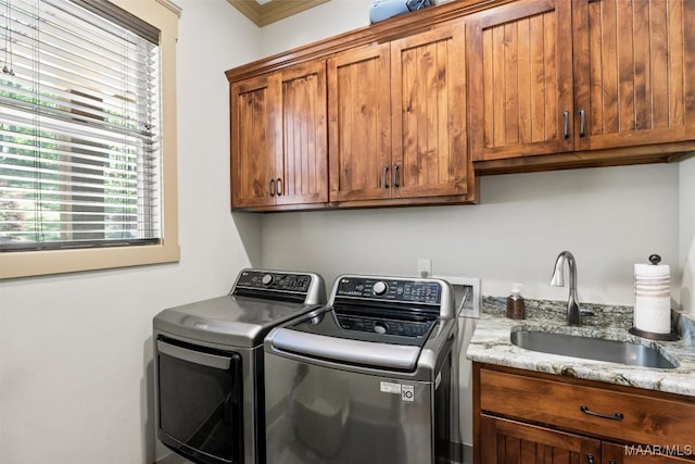 177 Tankersley Rd, Wetumpka, AL 36092 - laundry room with washing machine and dryer, a sink, crown molding, and cabinet space