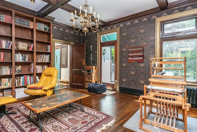 living area featuring plenty of natural light, wallpapered walls, and wood finished floors