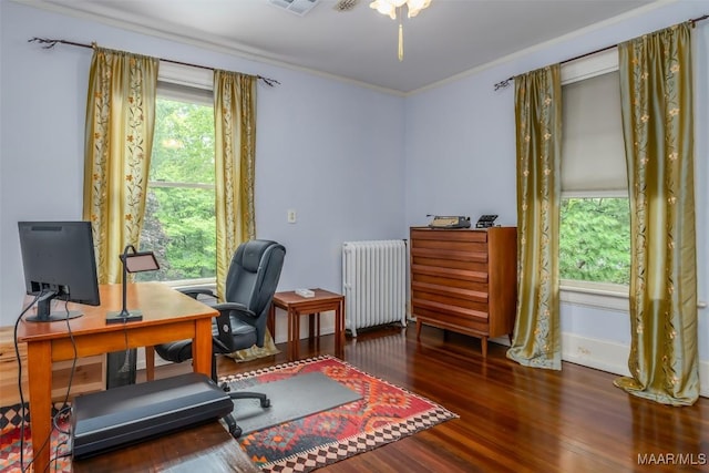 office area with visible vents, ornamental molding, radiator, and wood finished floors