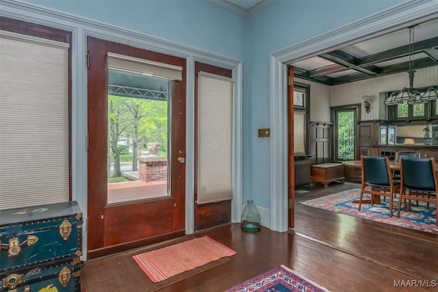 entryway featuring crown molding, wood finished floors, coffered ceiling, baseboards, and beam ceiling