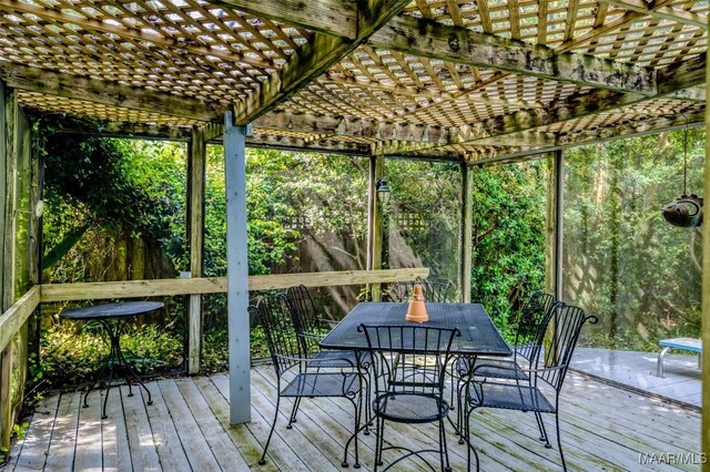 unfurnished sunroom with outdoor dining area
