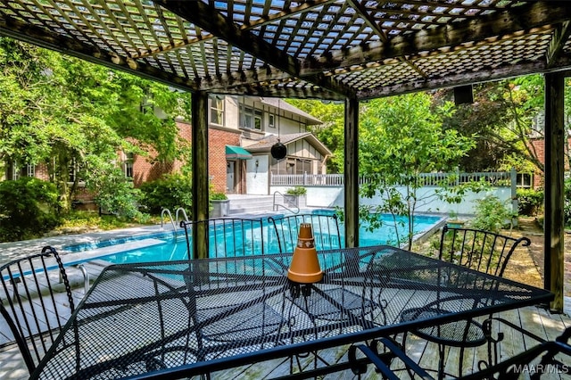 view of pool featuring a diving board, a pergola, a fenced in pool, and fence