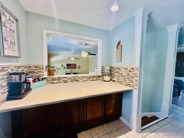 bathroom with tasteful backsplash, ceiling fan, decorative columns, and tile patterned flooring