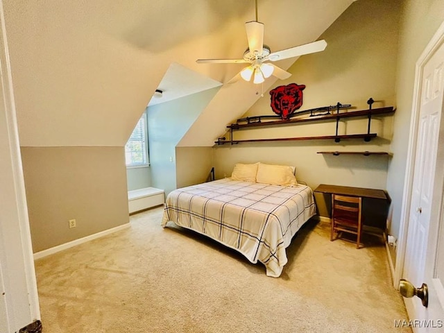 carpeted bedroom with ceiling fan, baseboards, and lofted ceiling