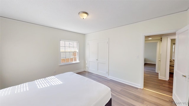2045 Gorgas St, Montgomery, AL 36106 - bedroom featuring a closet, baseboards, and wood finished floors