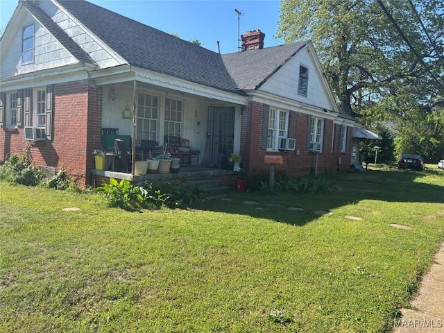 305 Federal Dr, Montgomery, AL 36107 - exterior space featuring a porch, roof with shingles, a lawn, and brick siding