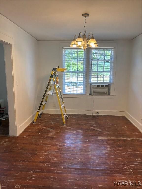 305 Federal Dr, Montgomery, AL 36107 - unfurnished dining area with cooling unit, a chandelier, wood finished floors, and a healthy amount of sunlight