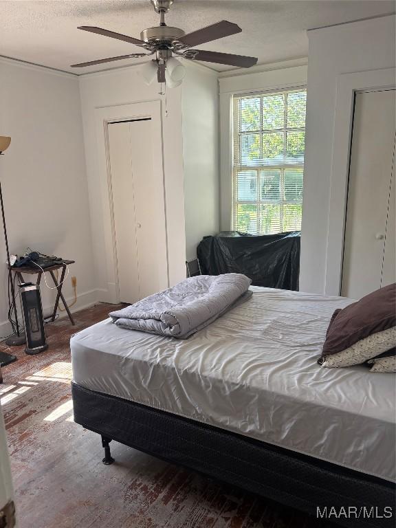 305 Federal Dr, Montgomery, AL 36107 - bedroom featuring wood finished floors, baseboards, and a ceiling fan