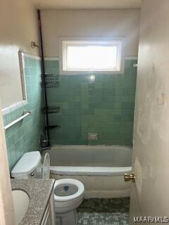 1985 Rigby St, Montgomery, AL 36110 - bathroom featuring tile patterned flooring, a healthy amount of sunlight, toilet, and vanity