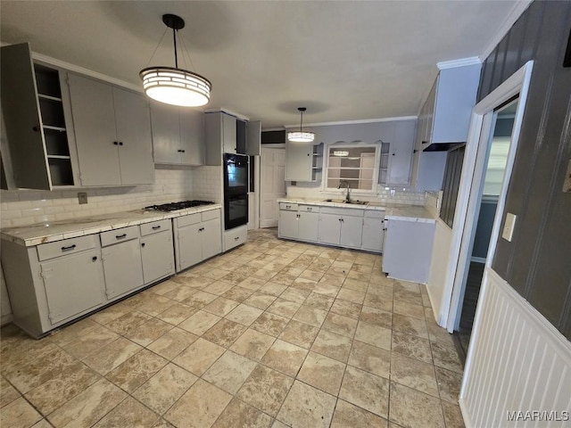 kitchen with decorative backsplash, crown molding, open shelves, and light countertops