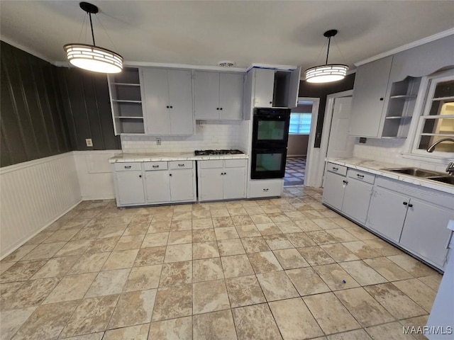 kitchen featuring dobule oven black, open shelves, a sink, stainless steel gas cooktop, and backsplash