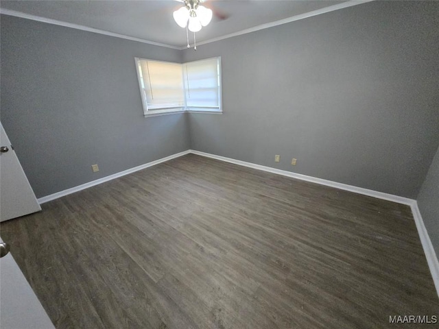 spare room featuring baseboards, a ceiling fan, crown molding, and dark wood-style floors