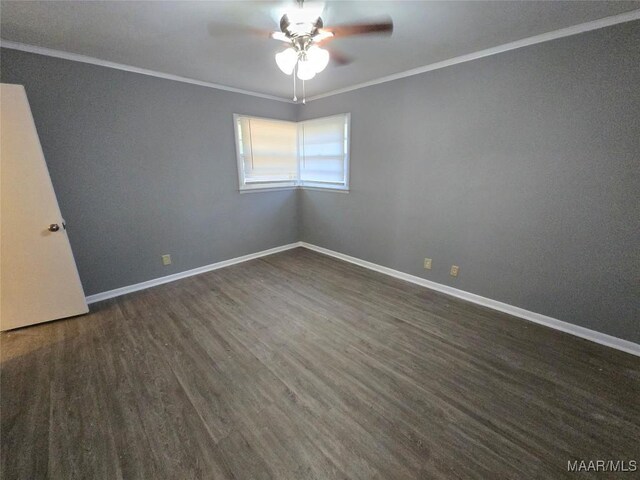empty room with ceiling fan, baseboards, ornamental molding, and dark wood-type flooring