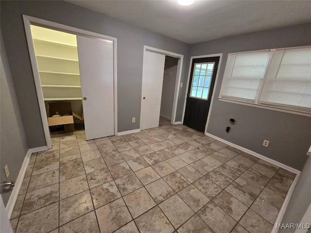 foyer entrance with baseboards