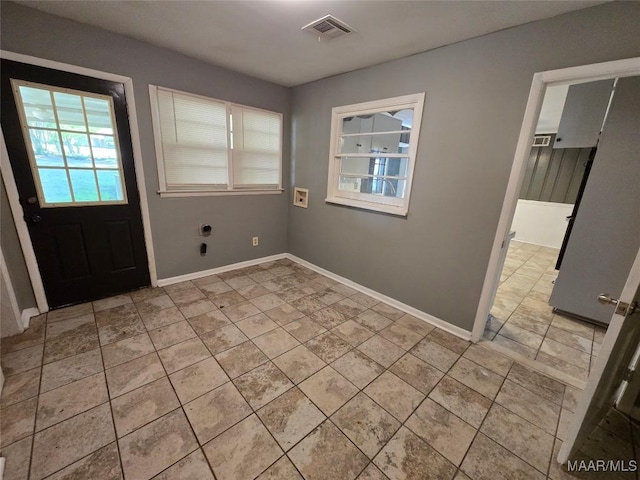 interior space with baseboards and visible vents