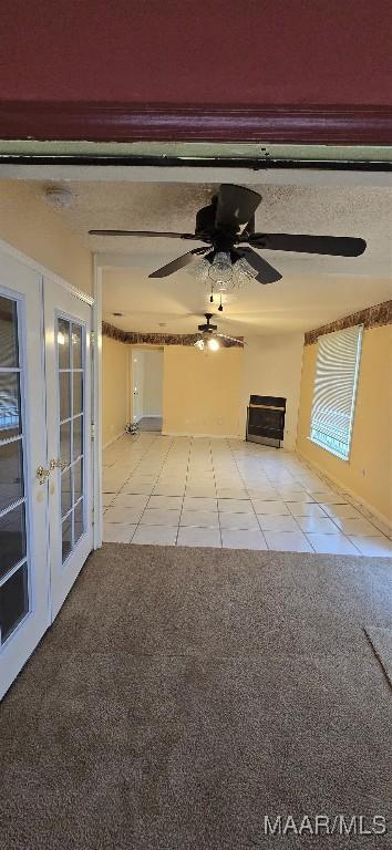 3313 Cross Creek Dr, Montgomery, AL 36116 - unfurnished living room featuring light tile patterned floors, light carpet, and a ceiling fan