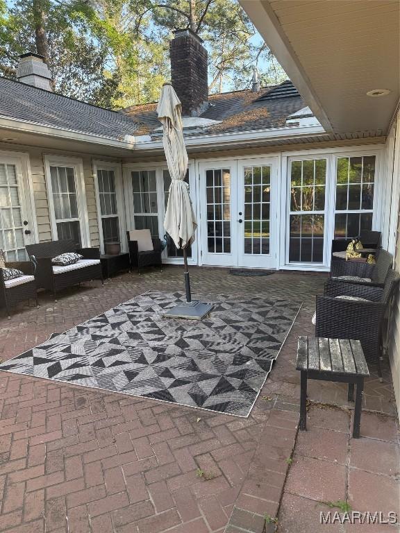 view of patio with outdoor lounge area and french doors