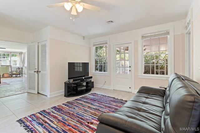 374 Rose Ln, Montgomery, AL 36104 - living room with baseboards, visible vents, ceiling fan, and light tile patterned flooring