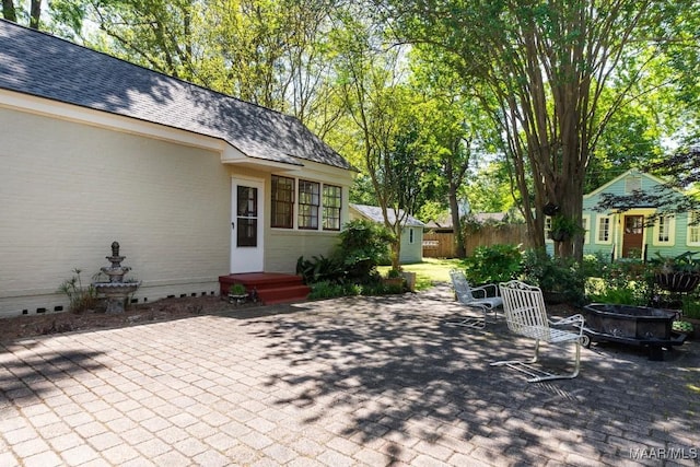 374 Rose Ln, Montgomery, AL 36104 - view of patio / terrace with an outdoor fire pit and fence