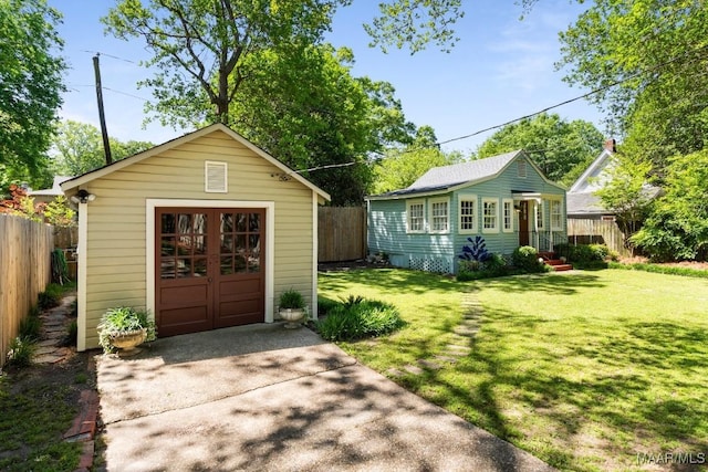 374 Rose Ln, Montgomery, AL 36104 - view of outbuilding featuring an outbuilding, fence, and driveway