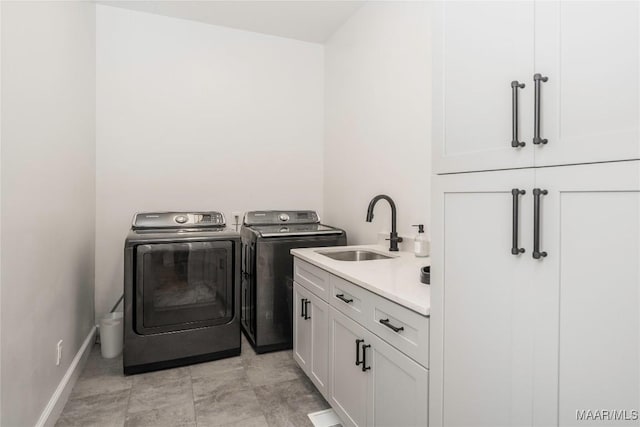 6432 Wynwood Pl, Montgomery, AL 36117 - laundry area with cabinet space, washing machine and dryer, and baseboards