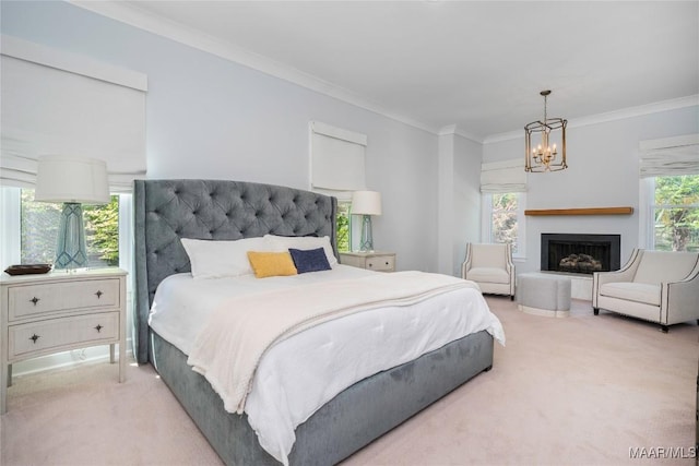 6432 Wynwood Pl, Montgomery, AL 36117 - bedroom featuring light carpet, crown molding, a chandelier, and a fireplace with raised hearth