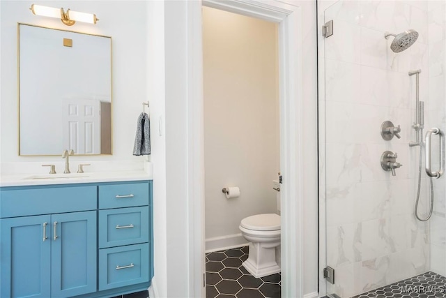 6432 Wynwood Pl, Montgomery, AL 36117 - bathroom featuring a stall shower, vanity, tile patterned floors, toilet, and baseboards