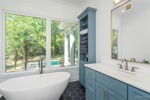6432 Wynwood Pl, Montgomery, AL 36117 - bathroom featuring plenty of natural light, a freestanding tub, vanity, and tile patterned floors