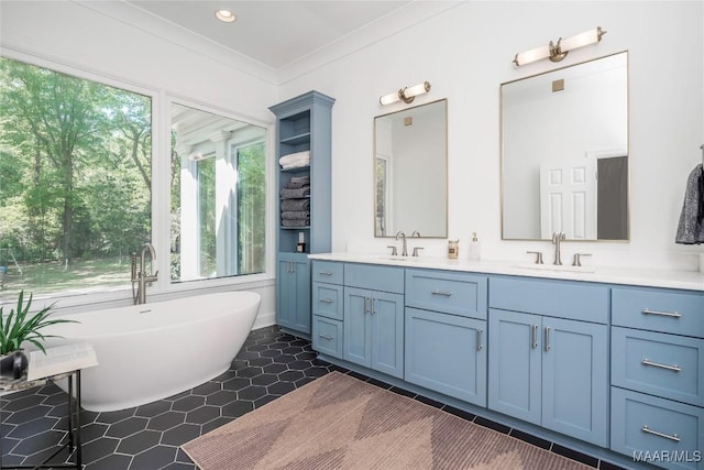 6432 Wynwood Pl, Montgomery, AL 36117 - full bath with a soaking tub, double vanity, tile patterned floors, recessed lighting, and crown molding