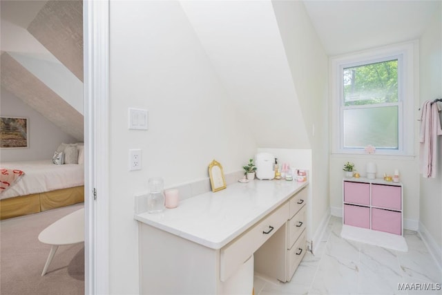 6432 Wynwood Pl, Montgomery, AL 36117 - ensuite bathroom with lofted ceiling, marble look tiles, and baseboards