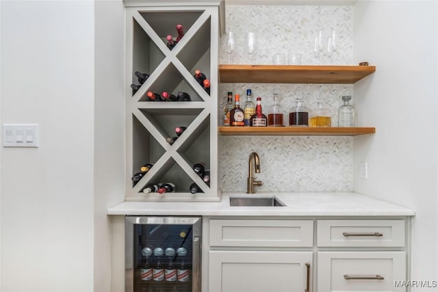 6432 Wynwood Pl, Montgomery, AL 36117 - indoor wet bar featuring beverage cooler and backsplash