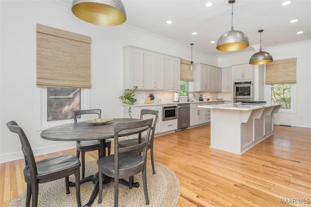 6432 Wynwood Pl, Montgomery, AL 36117 - kitchen with stainless steel appliances, light countertops, plenty of natural light, recessed lighting, and ornamental molding