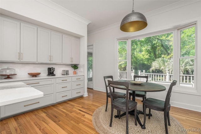 6432 Wynwood Pl, Montgomery, AL 36117 - dining space with crown molding, light wood-type flooring, and baseboards