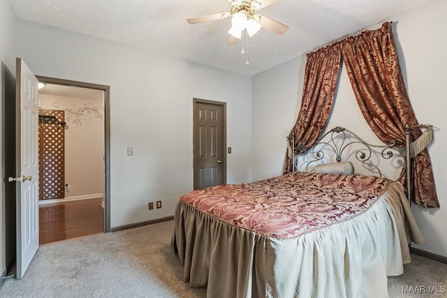 bedroom with carpet floors, baseboards, and ceiling fan
