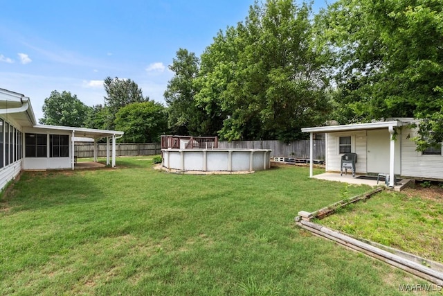 view of yard featuring a sunroom
