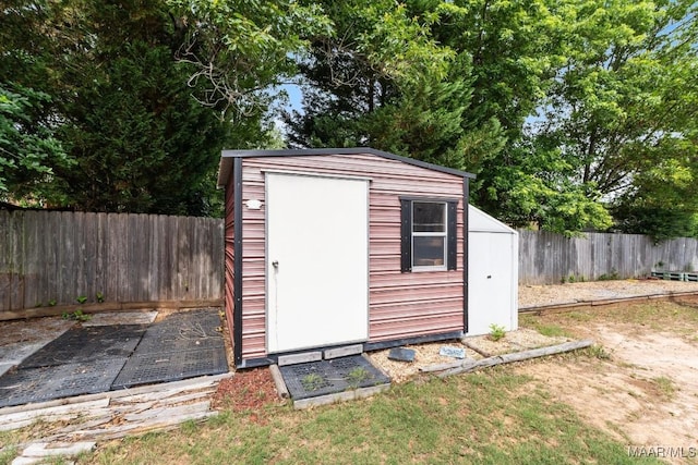 view of shed featuring a fenced backyard