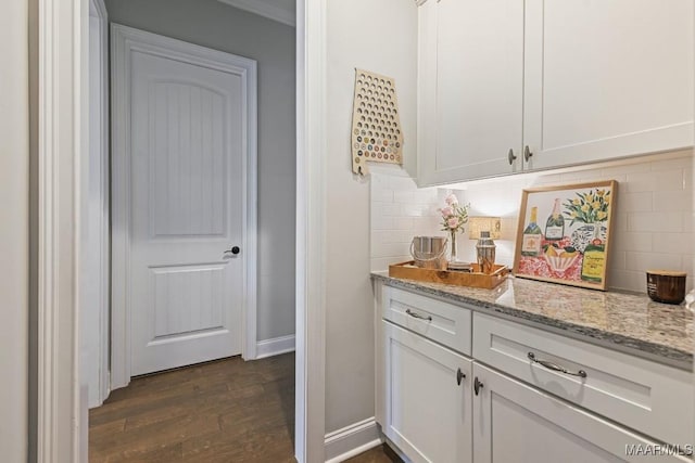 184 Houston St, Prattville, AL 36066 - bar featuring tasteful backsplash, baseboards, and dark wood-style flooring