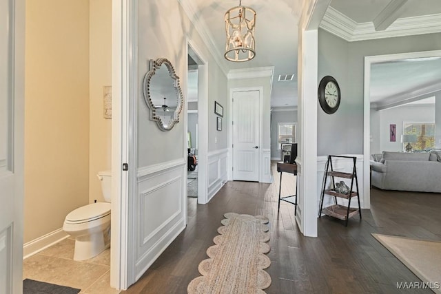 184 Houston St, Prattville, AL 36066 - entrance foyer featuring dark wood-type flooring, visible vents, crown molding, and an inviting chandelier