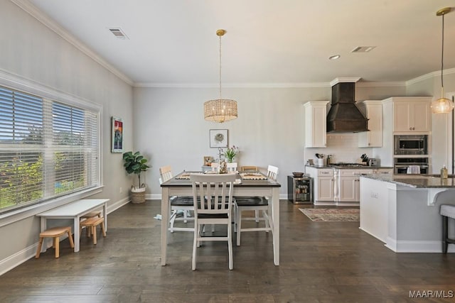 184 Houston St, Prattville, AL 36066 - kitchen with a kitchen breakfast bar, visible vents, crown molding, appliances with stainless steel finishes, and custom exhaust hood