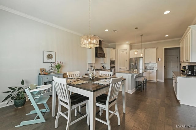 184 Houston St, Prattville, AL 36066 - dining room featuring ornamental molding, a notable chandelier, dark wood-type flooring, and recessed lighting