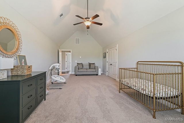 184 Houston St, Prattville, AL 36066 - bedroom featuring vaulted ceiling, baseboards, visible vents, light colored carpet, and a nursery area