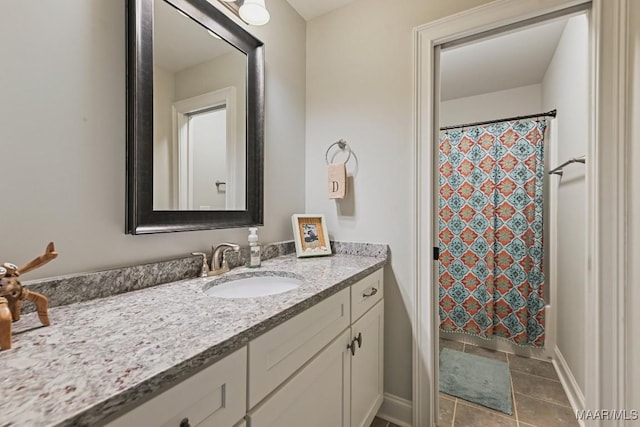 184 Houston St, Prattville, AL 36066 - bathroom with curtained shower, baseboards, tile patterned floors, and vanity