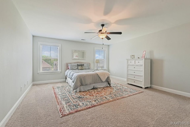 184 Houston St, Prattville, AL 36066 - carpeted bedroom featuring ceiling fan, baseboards, and multiple windows