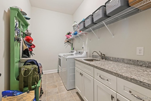 184 Houston St, Prattville, AL 36066 - washroom with light tile patterned floors, washing machine and clothes dryer, baseboards, and a sink