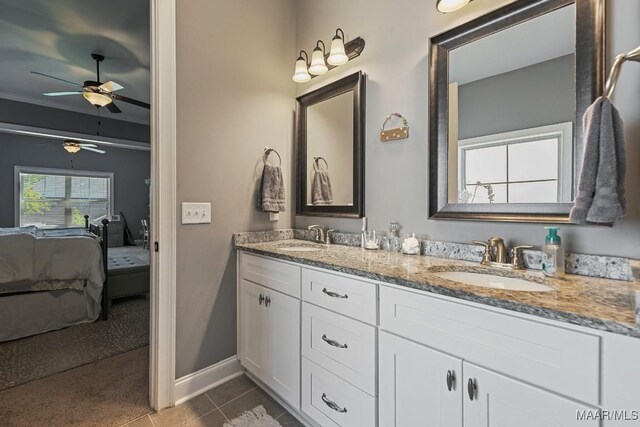 184 Houston St, Prattville, AL 36066 - bathroom featuring tile patterned floors, a sink, double vanity, a ceiling fan, and connected bathroom