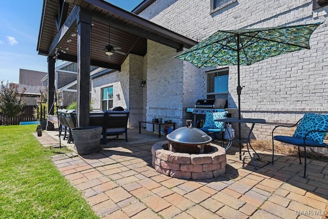 184 Houston St, Prattville, AL 36066 - view of patio / terrace with a fire pit, a grill, and ceiling fan
