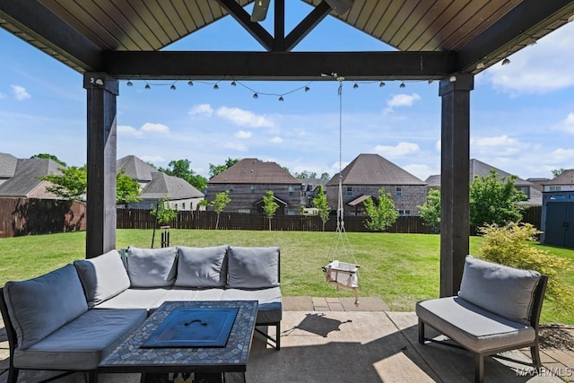 184 Houston St, Prattville, AL 36066 - view of patio with a fenced backyard, an outdoor living space with a fire pit, and a residential view