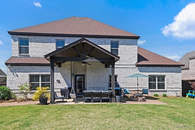 184 Houston St, Prattville, AL 36066 - rear view of house with a lawn, a ceiling fan, brick siding, and a patio