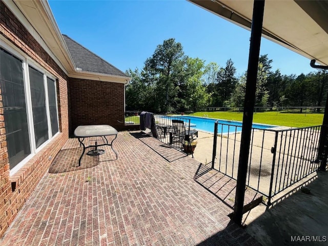 view of patio / terrace with a fenced in pool