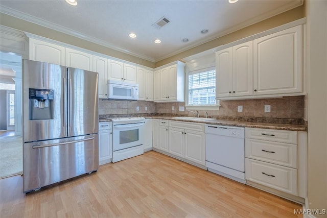kitchen with light wood finished floors, white appliances, white cabinetry, and crown molding